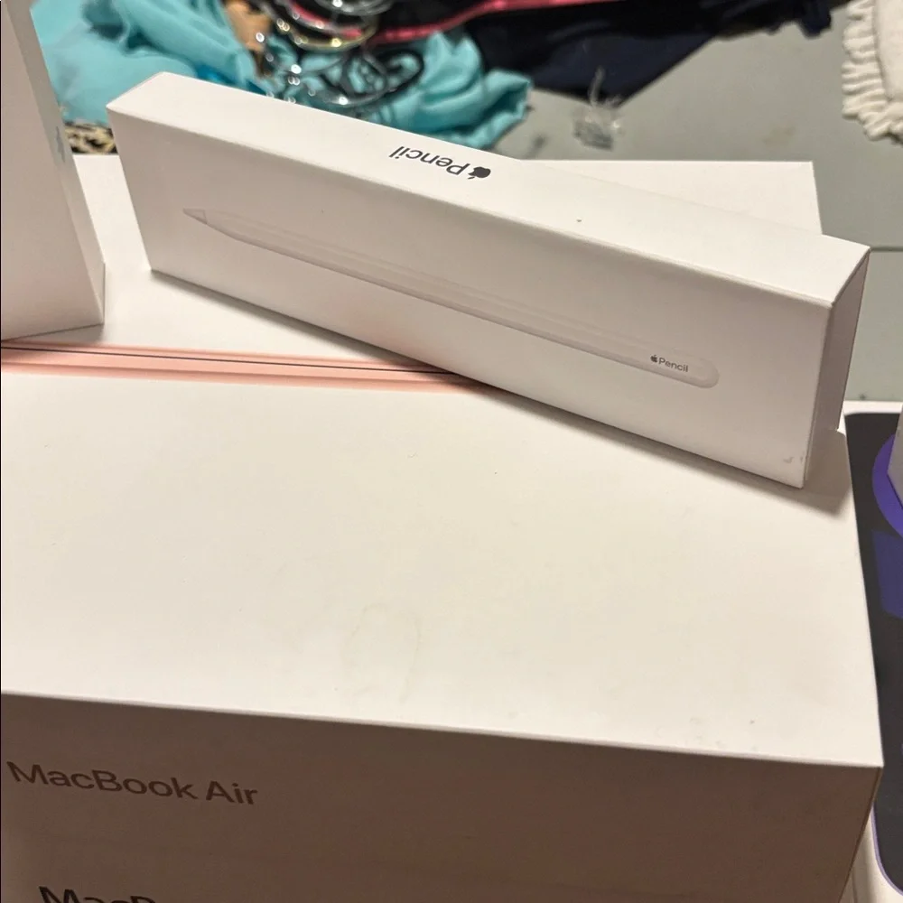2 Apple iPhone, AirPods, iPad, iPad Air, 1 Pencil, 3MacBook Air 9 Empty Boxes.
